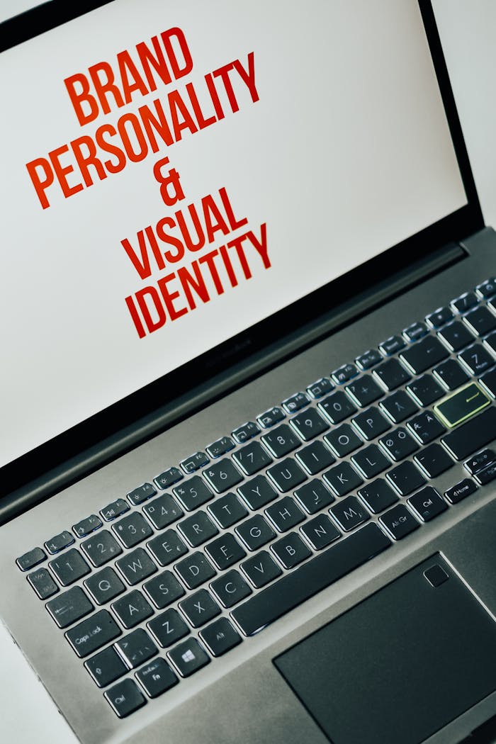 The Art of Drawing Readers In: Your attractive post title goes here Laptop screen showing text on brand personality and visual identity for marketing strategy.